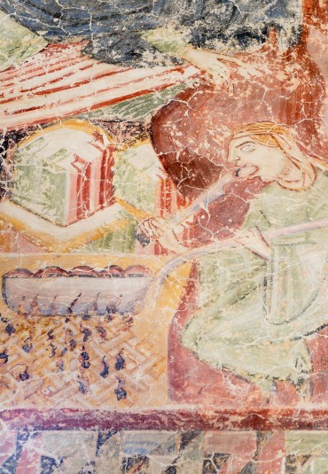 Un bellissimo affresco mostra una donna che mangia un canederlo nel Medioevo